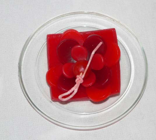 Red Lotus Candle on a Glass Plate